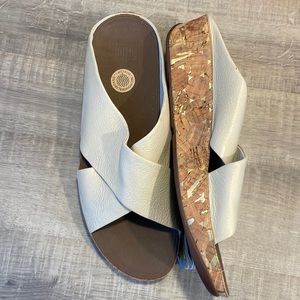New Fit Flop Kys cream leather sandals with cork wrap bottoms with gold specks.